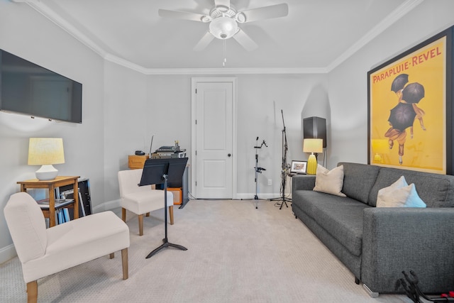 living room with crown molding, ceiling fan, and light carpet