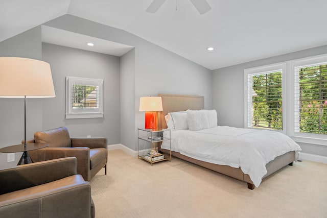 bedroom with lofted ceiling, light colored carpet, and ceiling fan