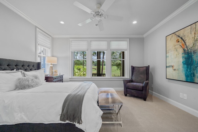 carpeted bedroom featuring crown molding and ceiling fan