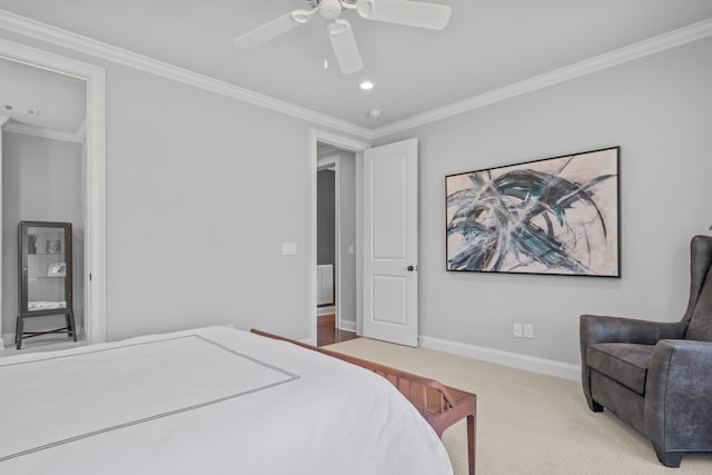 carpeted bedroom featuring crown molding and ceiling fan