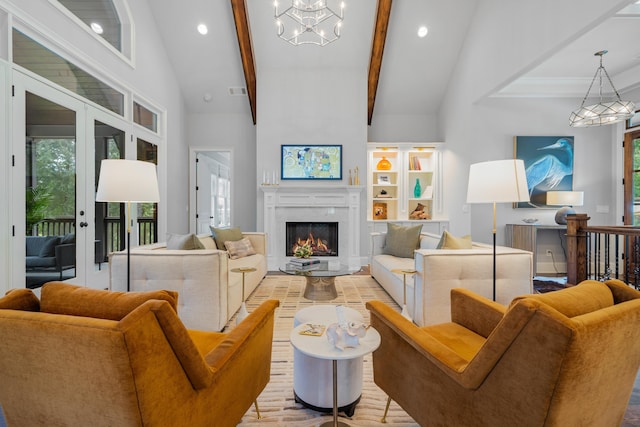 living room with beamed ceiling, an inviting chandelier, high vaulted ceiling, and french doors