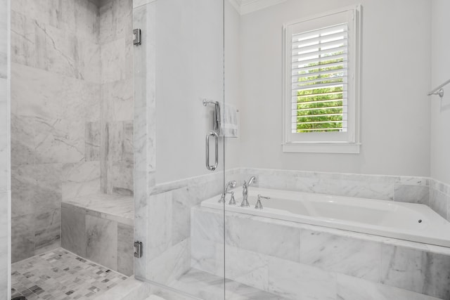 bathroom featuring ornamental molding and plus walk in shower