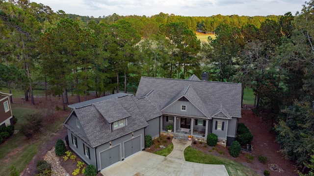 view of front of property featuring a porch and a garage