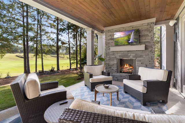 view of patio / terrace featuring an outdoor living space with a fireplace