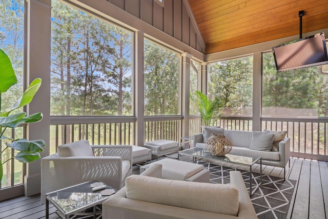 sunroom featuring lofted ceiling and wood ceiling