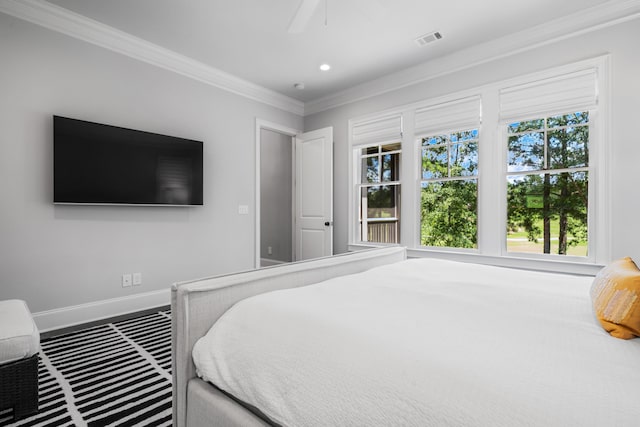 bedroom with crown molding and ceiling fan