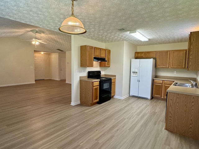 kitchen featuring sink, black electric range, white fridge with ice dispenser, decorative light fixtures, and light wood-type flooring