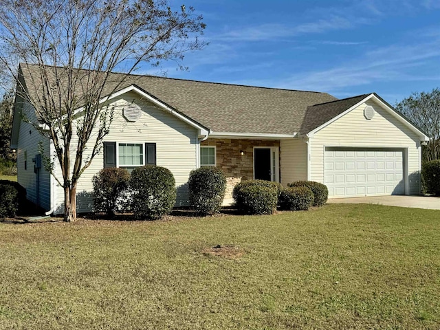 ranch-style house with a garage and a front yard