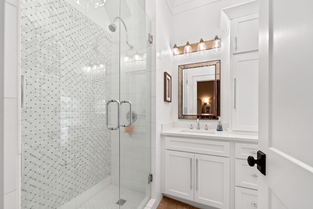 full bathroom featuring a shower stall and vanity