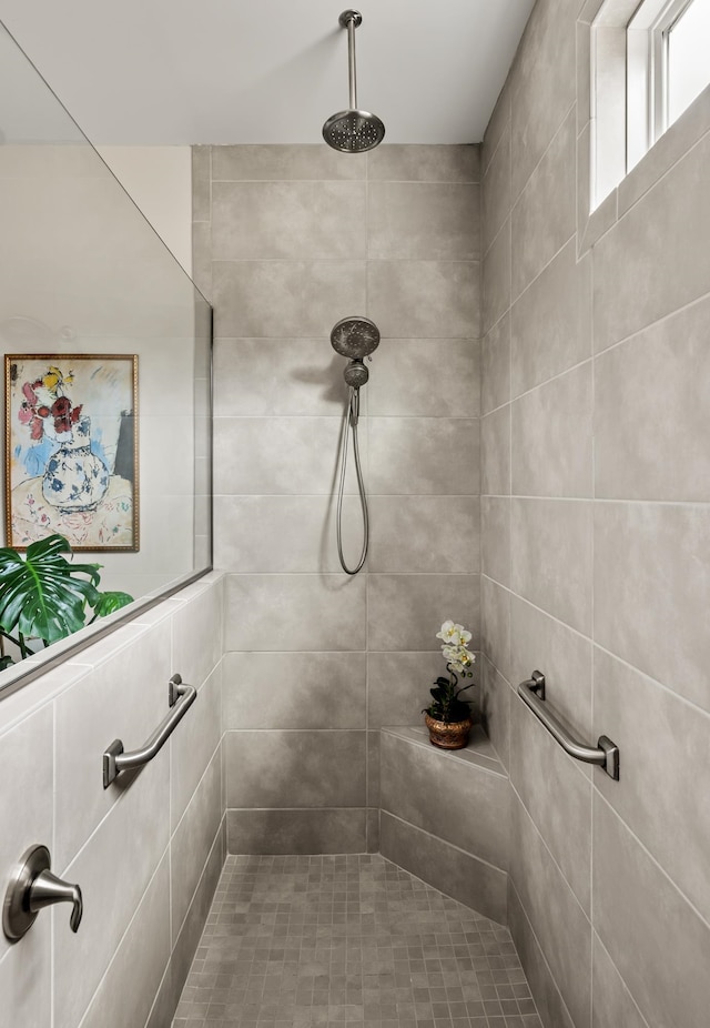 bathroom with tiled shower
