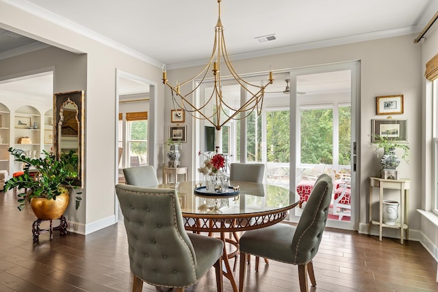 dining space featuring baseboards, a notable chandelier, dark wood-style floors, and crown molding