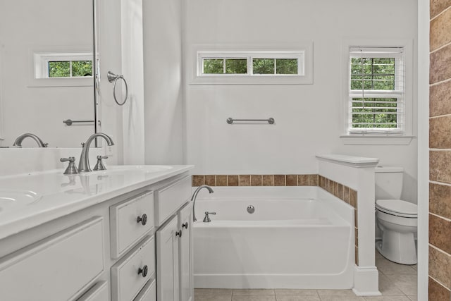 775 Markhams Dr, Madison, GA 30650 - bathroom featuring a bath, double vanity, toilet, and tile patterned flooring
