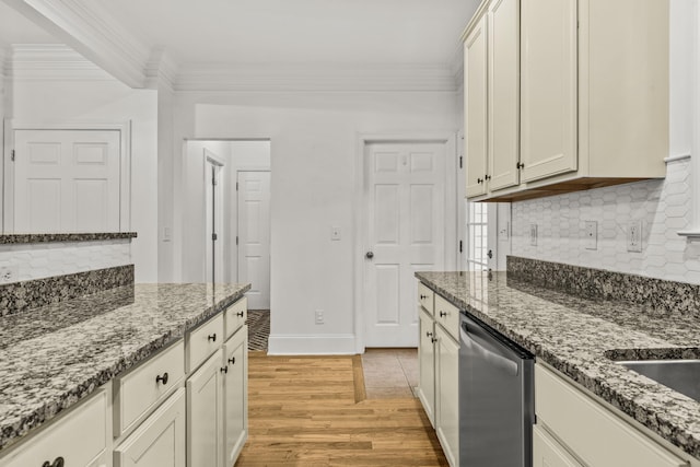 775 Markhams Dr, Madison, GA 30650 - kitchen with dishwasher, ornamental molding, light wood-style flooring, backsplash, and dark stone countertops