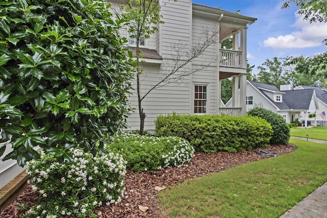 775 Markhams Dr, Madison, GA 30650 - view of home's exterior with a balcony and a yard