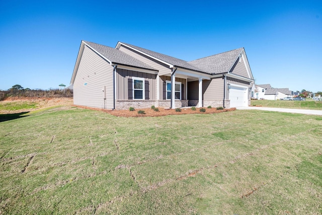 view of front of property featuring a garage and a front yard