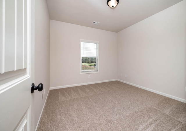 spare room featuring carpet flooring