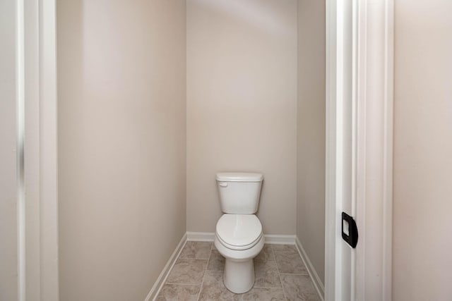 bathroom with tile patterned floors and toilet