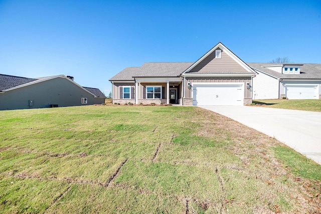 view of front facade featuring a garage and a front lawn