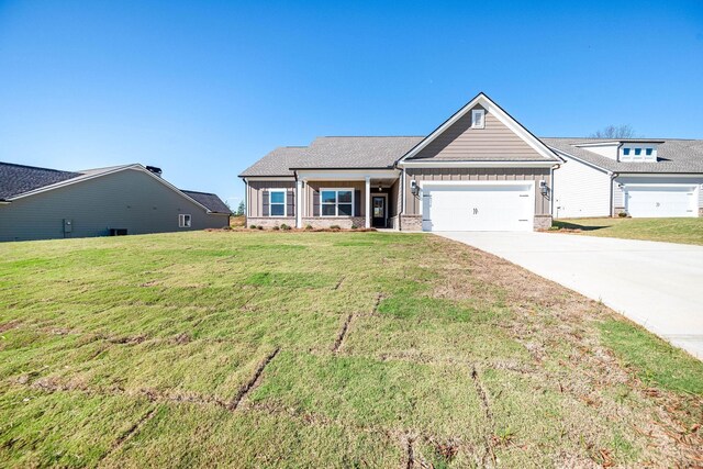 view of front facade featuring a garage and a front lawn