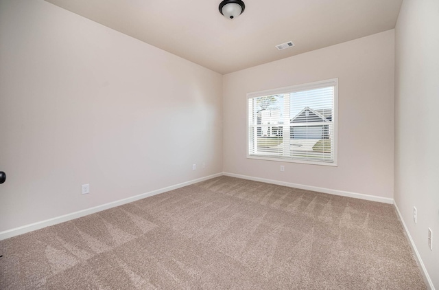 spare room with carpet floors