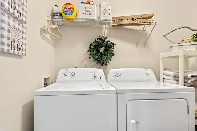 washroom with laundry area and washer and clothes dryer