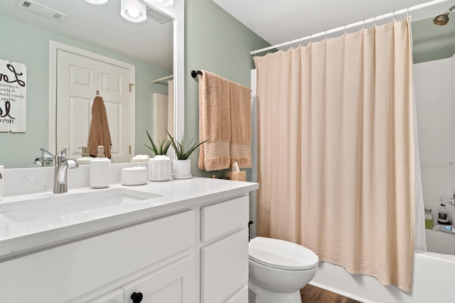 full bath with shower / bath combination with curtain, visible vents, toilet, vanity, and wood finished floors