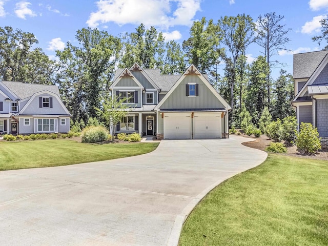 craftsman house with a garage and a front lawn