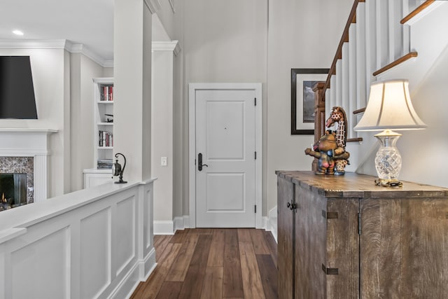 hallway featuring dark hardwood / wood-style flooring and ornamental molding