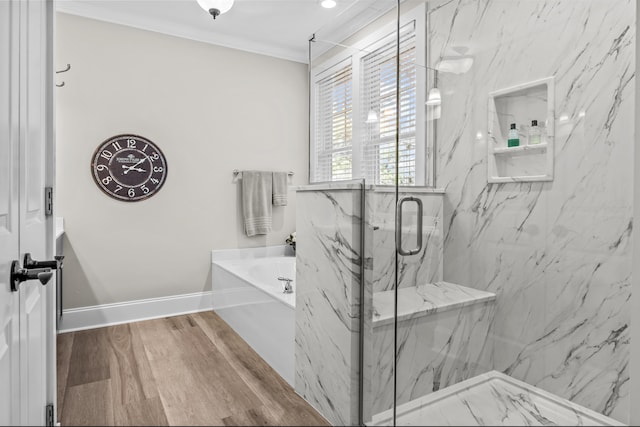 bathroom featuring hardwood / wood-style floors, crown molding, and separate shower and tub