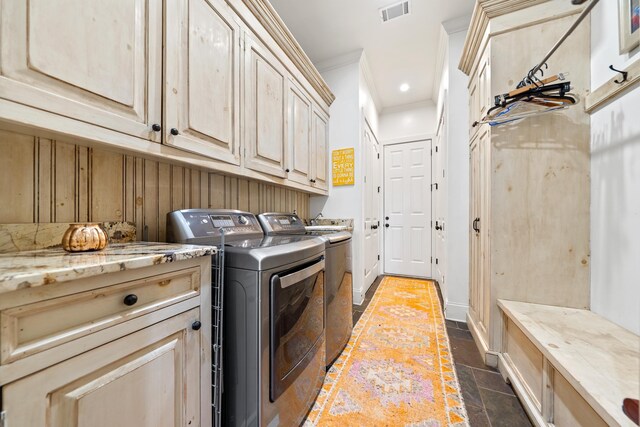 112 Arbors Ln, Eatonton, GA 31024 - laundry room with crown molding, separate washer and dryer, stone tile floors, cabinet space, and visible vents