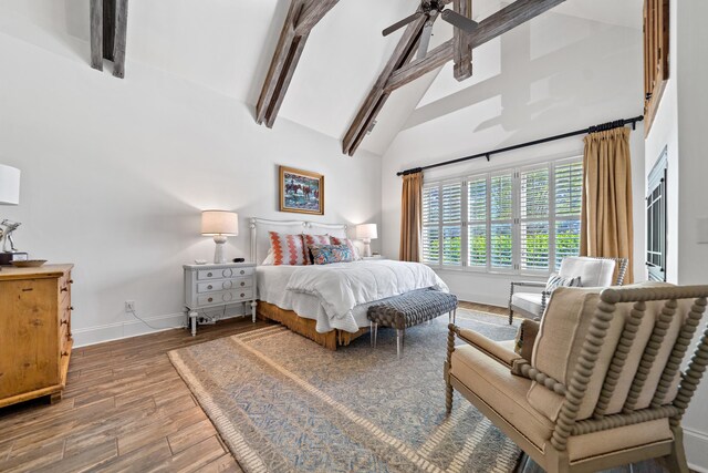 112 Arbors Ln, Eatonton, GA 31024 - bedroom with high vaulted ceiling, baseboards, wood finished floors, and beamed ceiling