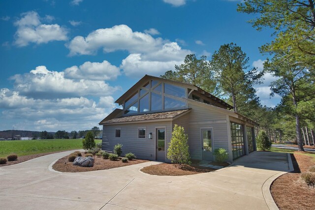 112 Arbors Ln, Eatonton, GA 31024 - view of home's exterior featuring concrete driveway