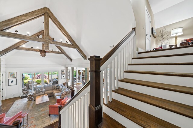 112 Arbors Ln, Eatonton, GA 31024 - staircase featuring high vaulted ceiling and beamed ceiling