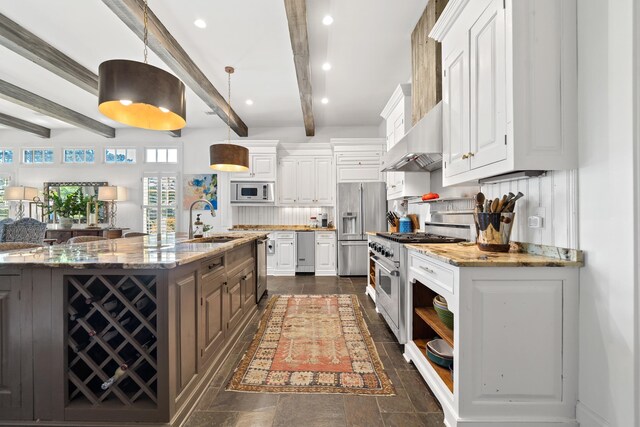 112 Arbors Ln, Eatonton, GA 31024 - kitchen with a sink, high end appliances, white cabinets, range hood, and beam ceiling