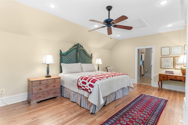 bedroom with lofted ceiling, light hardwood / wood-style flooring, and ceiling fan