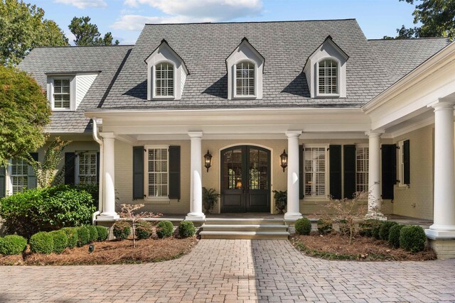 property entrance featuring french doors