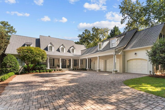 new england style home with a garage