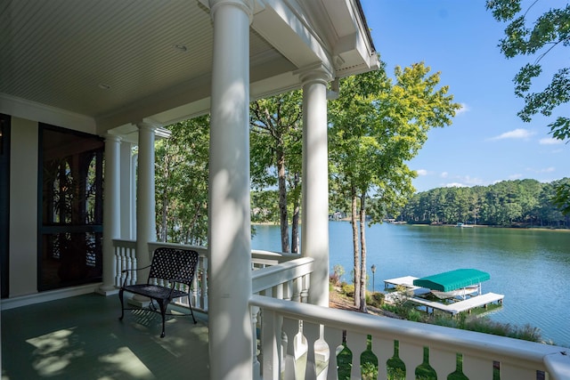 exterior space featuring a boat dock and a water view