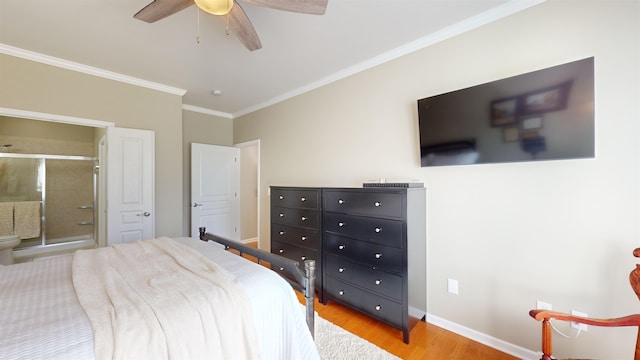 bedroom featuring connected bathroom, ornamental molding, light hardwood / wood-style floors, and ceiling fan