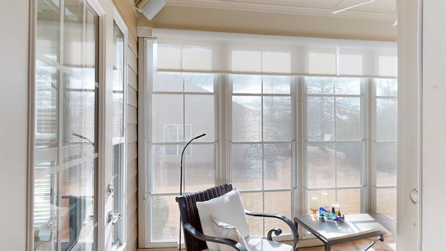 sunroom / solarium featuring a healthy amount of sunlight