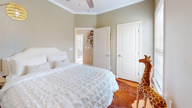 bedroom featuring multiple windows and crown molding