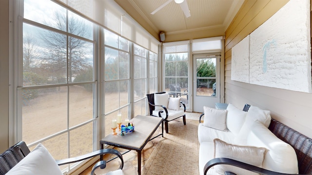 sunroom featuring ceiling fan