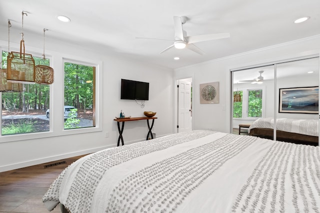 114 Oak Ridge Ln, Eatonton, GA 31024 - bedroom with multiple windows, wood finished floors, ornamental molding, recessed lighting, and a closet