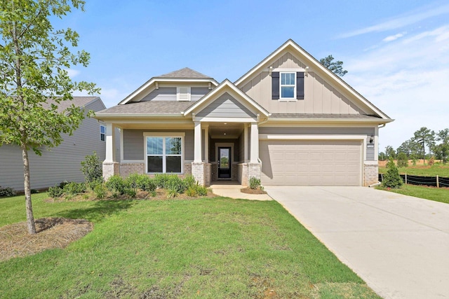 craftsman house with a garage and a front yard