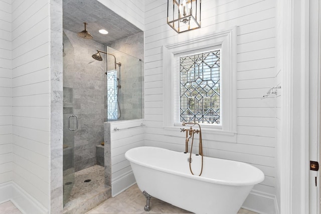 1011 Dogwood Dr, Greensboro, GA 30642 - bathroom with a shower stall, a freestanding bath, and a chandelier