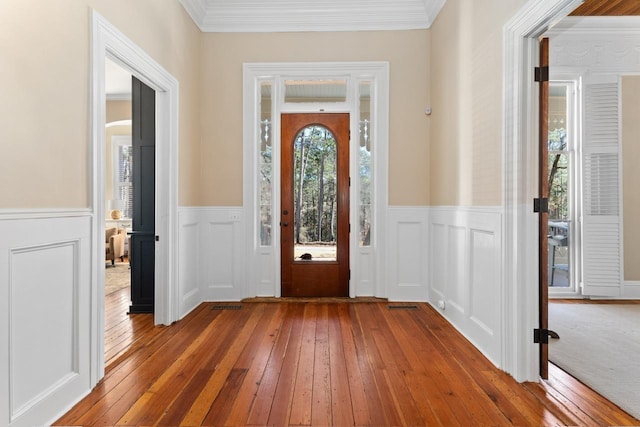 1011 Dogwood Dr, Greensboro, GA 30642 - entrance foyer featuring wainscoting, hardwood / wood-style flooring, and ornamental molding
