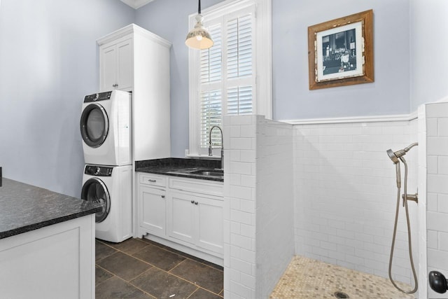 1011 Dogwood Dr, Greensboro, GA 30642 - clothes washing area with a sink, stacked washer / dryer, and laundry area