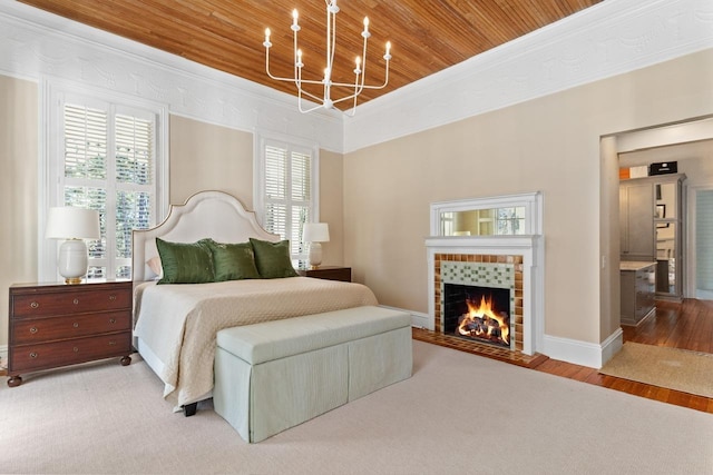 1011 Dogwood Dr, Greensboro, GA 30642 - bedroom featuring an inviting chandelier, a fireplace, a tray ceiling, ornamental molding, and wooden ceiling