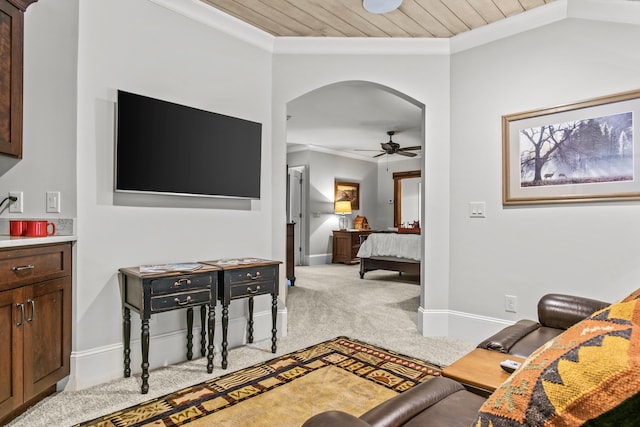 bedroom with crown molding, light colored carpet, and wooden ceiling