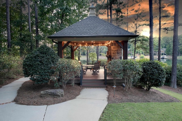 view of property's community with a gazebo and a wooden deck